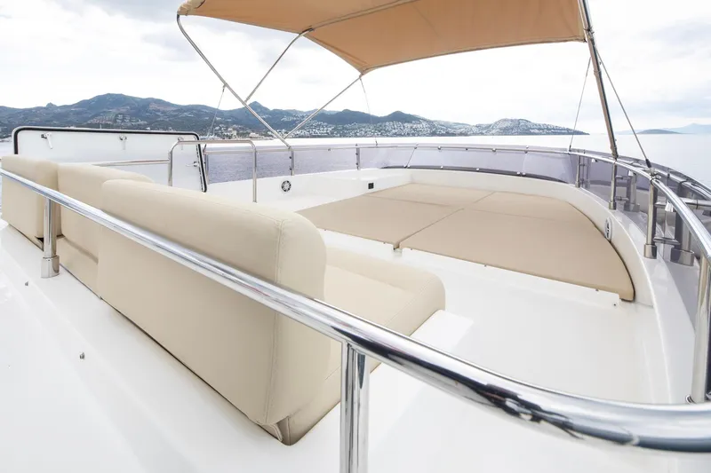  Yacht Photos Pics Luxurious 2014 Custom Line Navetta 26 Crescendo yacht deck with seating and canopy.
