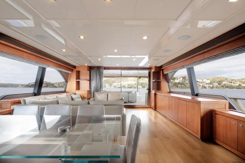  Yacht Photos Pics Luxurious interior of 2014 Custom Line Navetta 26 Crescendo yacht with modern furnishings and panoramic windows.