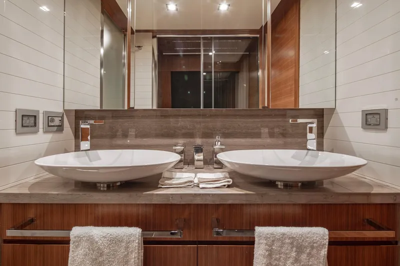  Yacht Photos Pics Luxurious bathroom with dual sinks on a 2014 Custom Line Navetta 26 Crescendo yacht.