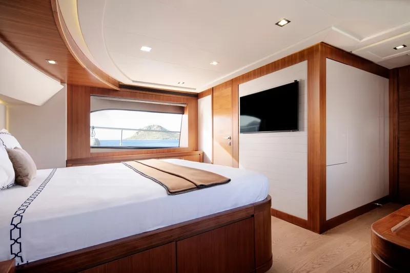  Yacht Photos Pics Luxurious bedroom interior of 2014 Custom Line Navetta 26 Crescendo yacht with ocean view.
