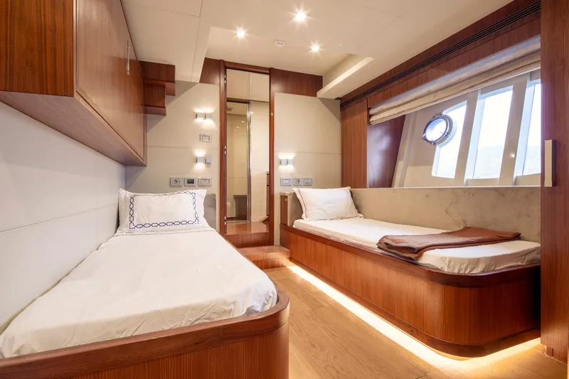  Yacht Photos Pics Luxurious cabin interior of 2014 Custom Line Navetta 26 Crescendo yacht with twin beds.