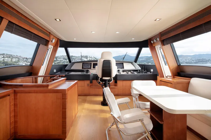  Yacht Photos Pics Luxurious interior of 2014 Custom Line Navetta 26 Crescendo yacht with modern helm and seating area.