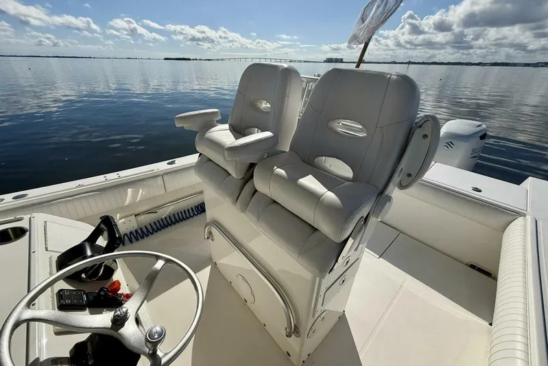 2006 Regulator 29fs Yacht Photos Pics 2006 Regulator 29 Forward Seating boat interior with dual helm seats on calm water.