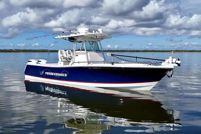 2006 Regulator 29fs Yacht Photos Pics 2006 Regulator 29 Forward Seating boat on calm water under cloudy sky.