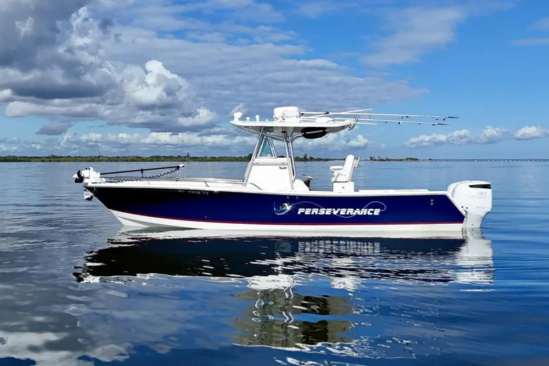 2006 Regulator 29fs Yacht Photos Pics 2006 Regulator 29 Forward Seating boat on calm water under a blue sky.