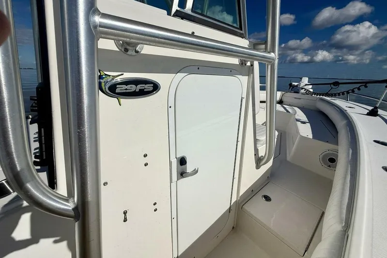 2006 Regulator 29fs Yacht Photos Pics 2006 Regulator 29 Forward Seating boat, white exterior, stainless steel railings, clear sky background.