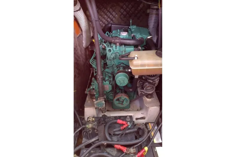  Yacht Photos Pics Engine compartment of a 2004 Beneteau First 40.7 sailboat, featuring visible components and wiring.