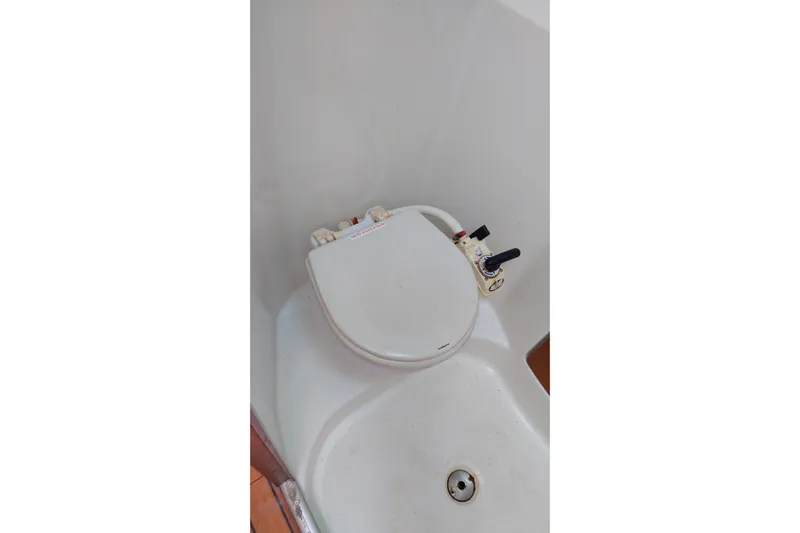  Yacht Photos Pics Boat bathroom with compact toilet on 2004 Beneteau First 40.7 yacht.