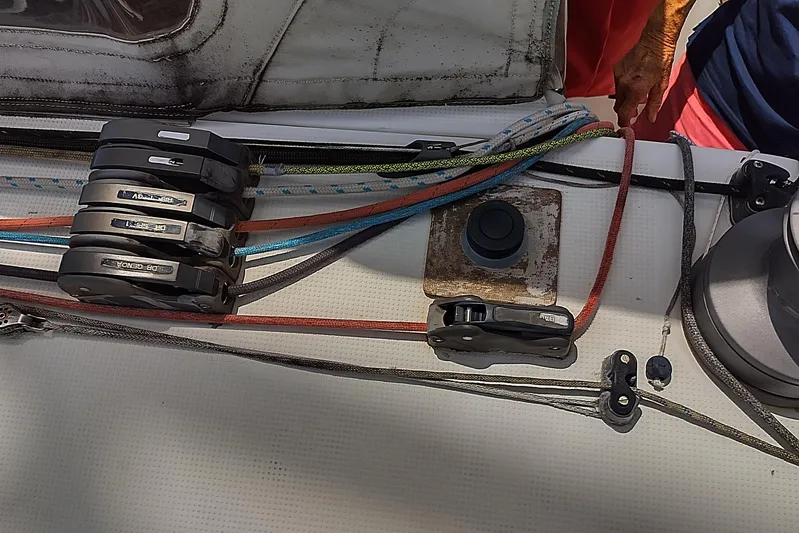  Yacht Photos Pics Deck rigging on a 2004 Beneteau First 40.7 sailboat, featuring colorful ropes and pulleys.