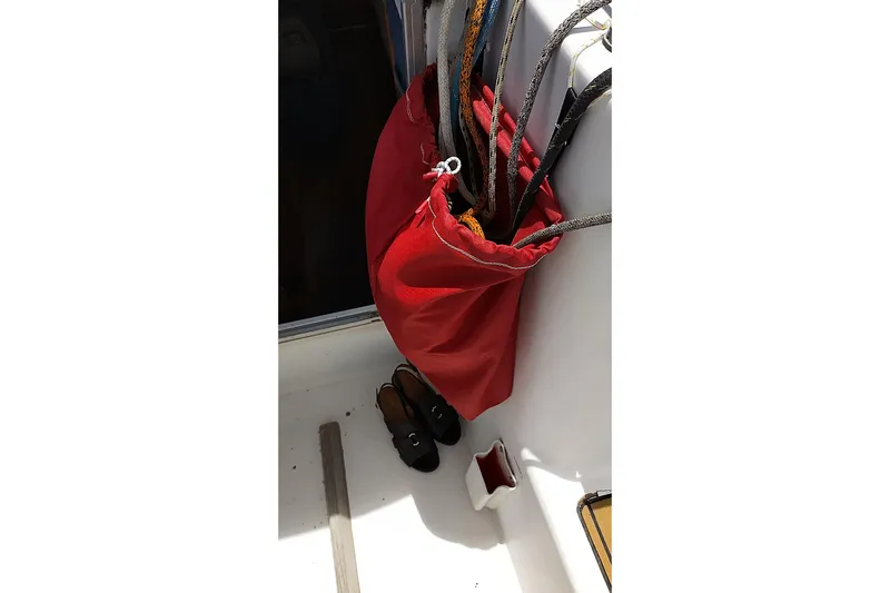  Yacht Photos Pics Red rope bag and shoes on Beneteau First 40.7 sailboat deck, 2004 model.