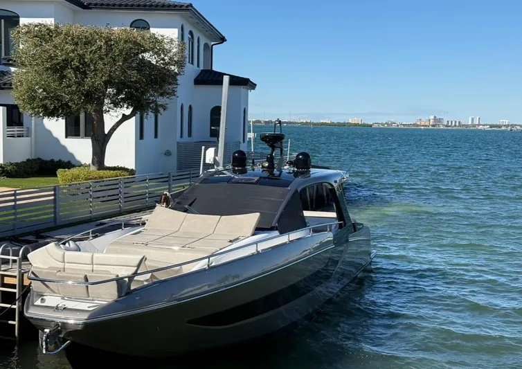  Yacht Photos Pics Azimut Verve 47 yacht docked by waterfront home, 2021 model.