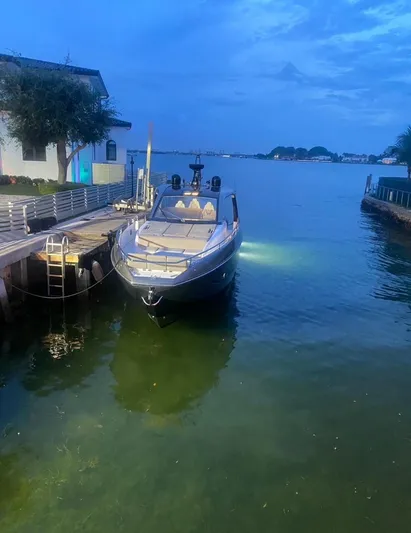  Yacht Photos Pics 2021 Azimut Verve 47 yacht docked at a serene waterfront during twilight.