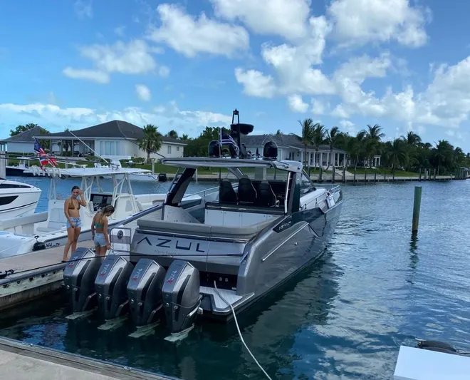  Yacht Photos Pics Azimut Verve 47 yacht docked, 2021 model, with four engines, in a scenic marina.