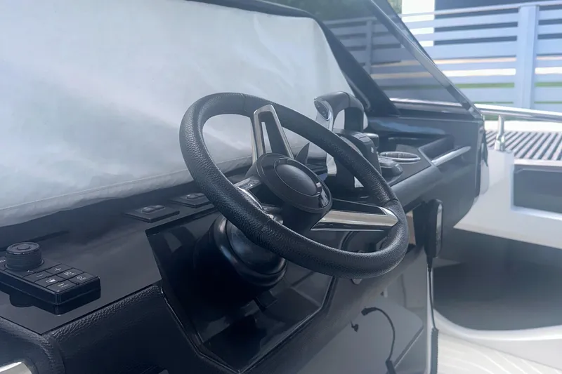  Yacht Photos Pics Steering wheel of 2021 Azimut Verve 47 yacht, showcasing modern design and controls.