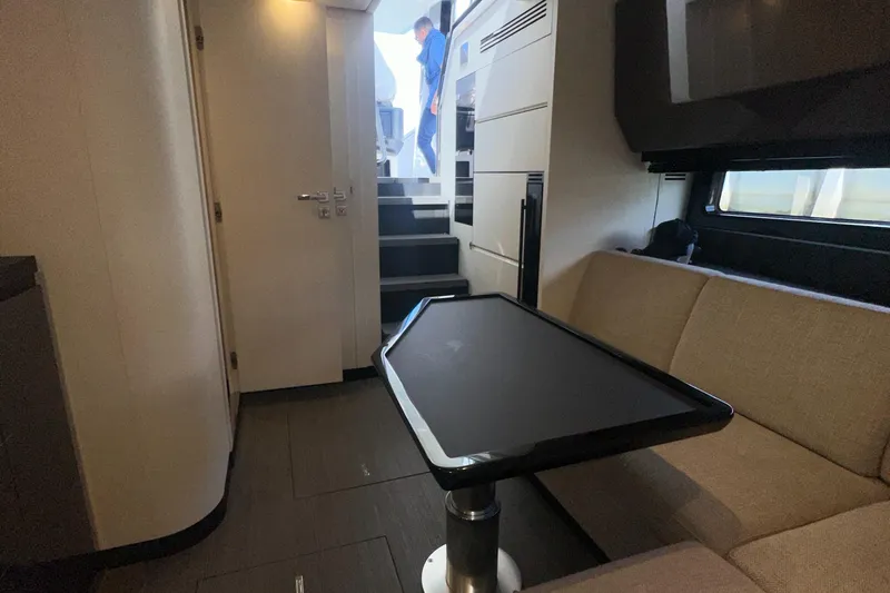  Yacht Photos Pics Interior of 2021 Azimut Verve 47 yacht with modern seating and table.