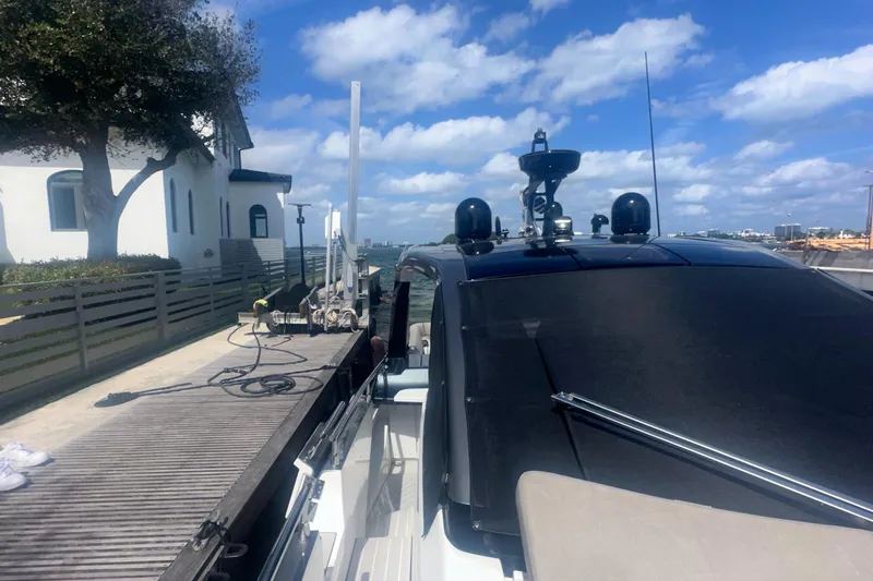  Yacht Photos Pics Azimut Verve 47 yacht docked, 2021 model, under a clear blue sky.