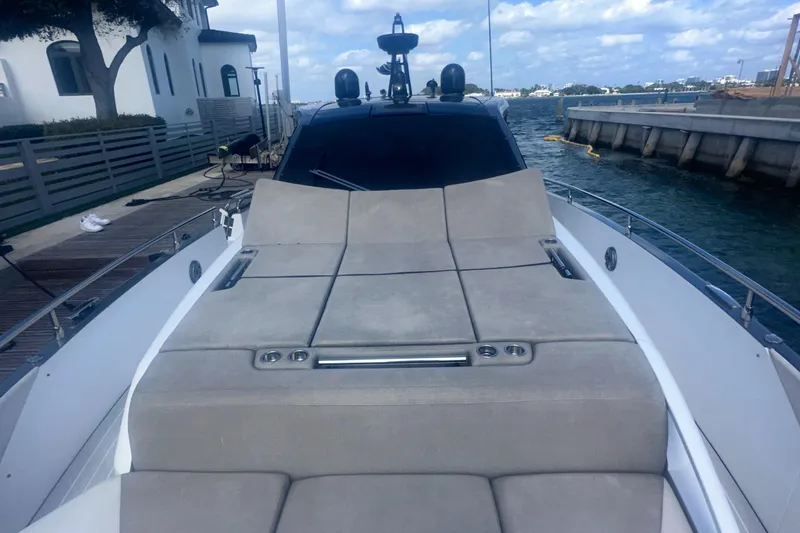  Yacht Photos Pics 2021 Azimut Verve 47 yacht with spacious sunbathing area, docked by the waterfront.