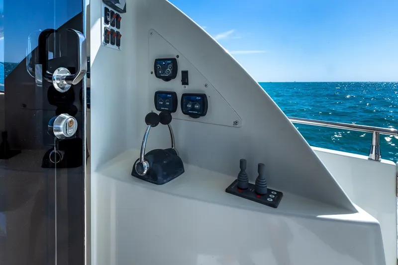  Yacht Photos Pics Control panel of a 2005 Marquis 59 yacht with ocean view.