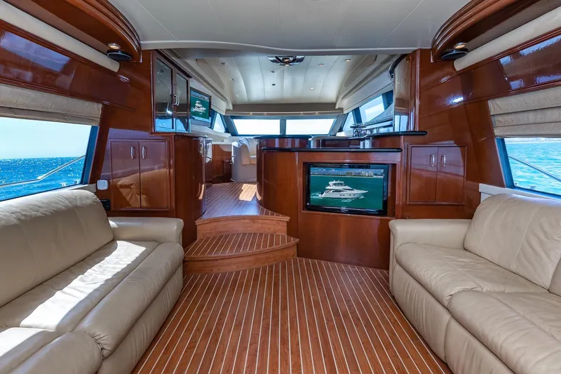  Yacht Photos Pics Luxurious interior of a 2005 Marquis 59 yacht with leather seating and wood finishes.