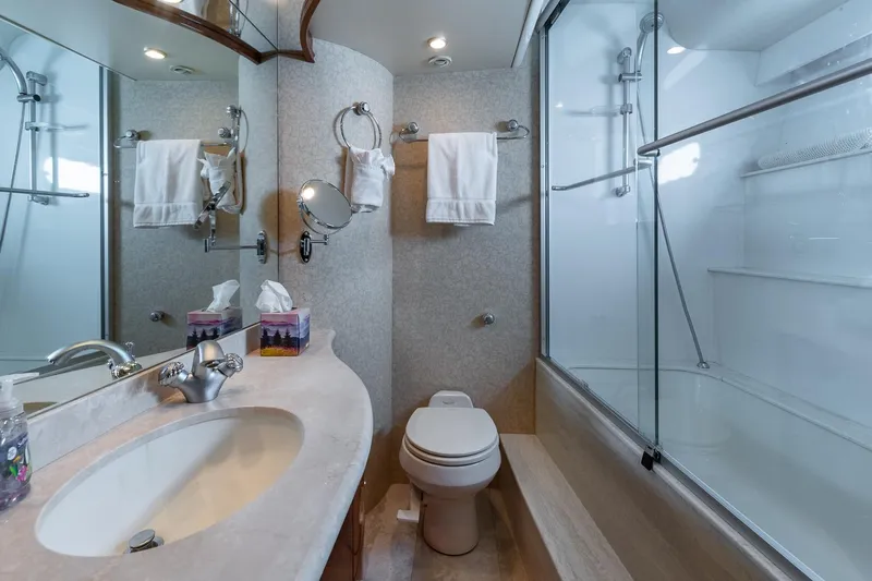  Yacht Photos Pics Luxurious 2005 Marquis 59 yacht bathroom with modern fixtures and elegant design.