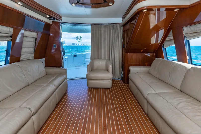  Yacht Photos Pics Luxurious interior of 2005 Marquis 59 yacht with leather seating and ocean view.