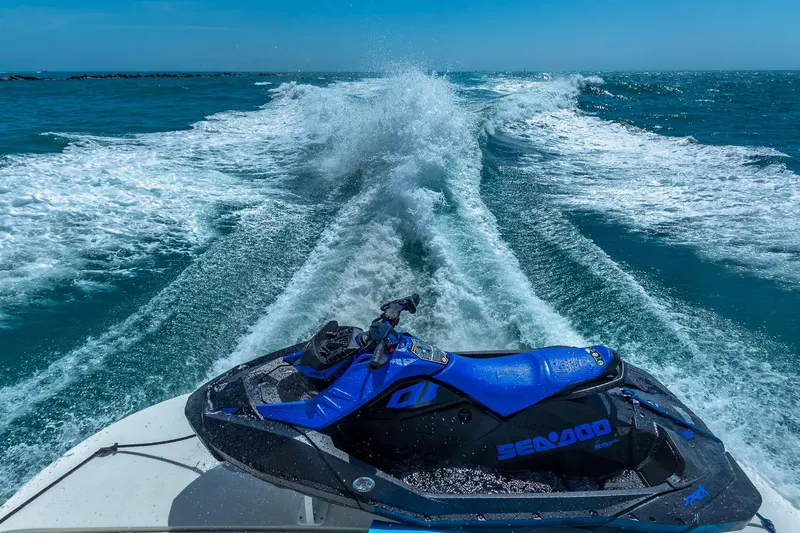  Yacht Photos Pics Jet ski on a 2005 Marquis 59 yacht, cruising through ocean waves.