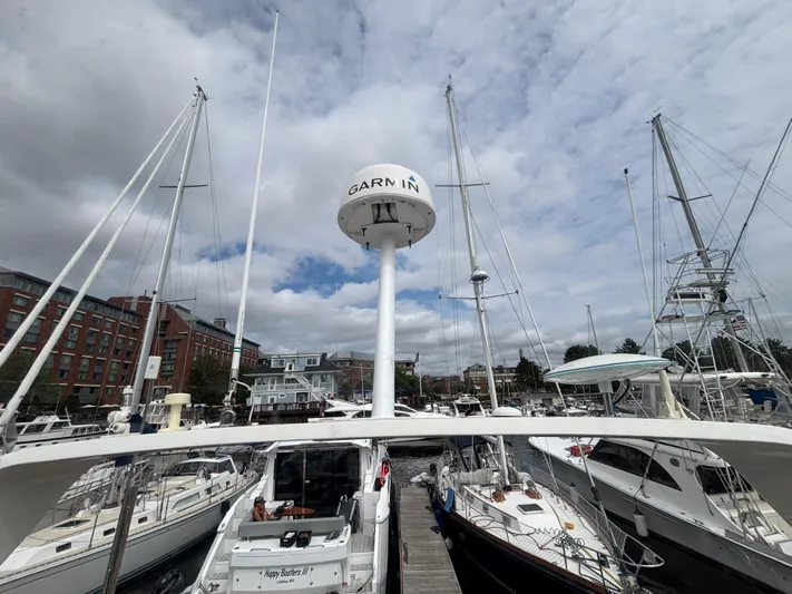 Sea Questah Yacht Photos Pics 2007 Carver 35 Super Sport yacht docked at a marina under cloudy skies.