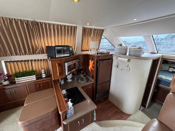 Sea Questah Yacht Photos Pics Interior of 2007 Carver 35 Super Sport yacht with kitchen and seating area.