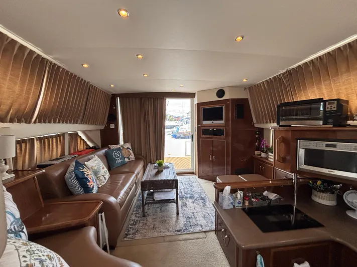 Sea Questah Yacht Photos Pics Interior of a 2007 Carver 35 Super Sport yacht with cozy seating and modern amenities.