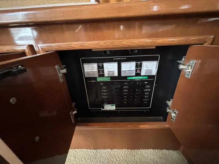 Sea Questah Yacht Photos Pics Electrical control panel inside a 2007 Carver 35 Super Sport boat cabinet.