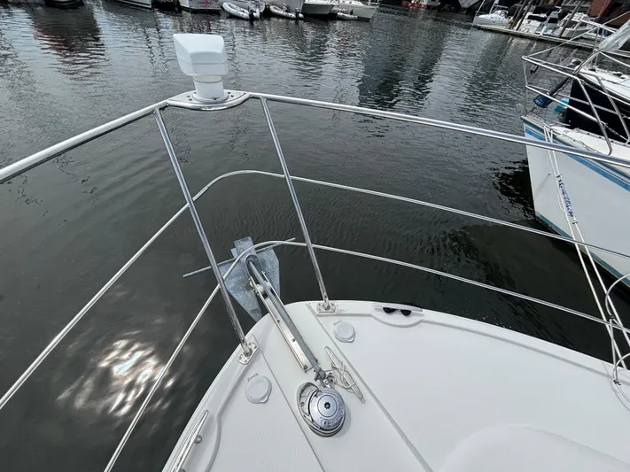 Sea Questah Yacht Photos Pics 2007 Carver 35 Super Sport yacht bow with anchor, docked in marina.