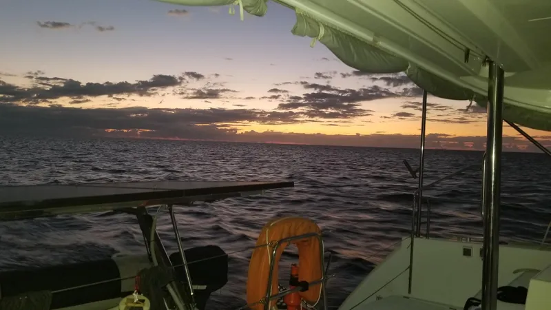 The Next Thing Yacht Photos Pics Sunset view from 2010 Lagoon 400 owner's version catamaran on the open sea.