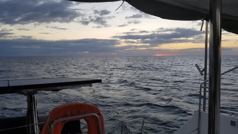 The Next Thing Yacht Photos Pics Sunset view from Lagoon 400 sailboat, 2010 model, on open sea.