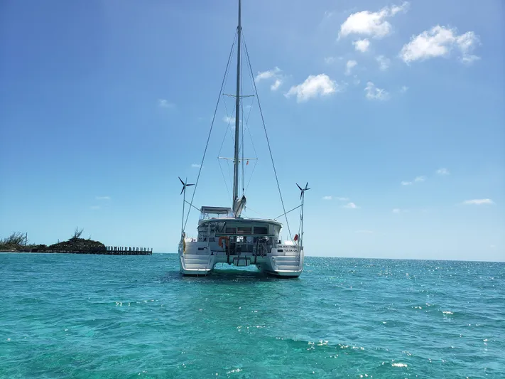 The Next Thing Yacht Photos Pics Lagoon 400 catamaran sailing on clear blue waters under a sunny sky, 2010 model.