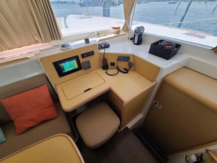 The Next Thing Yacht Photos Pics Navigation station on 2010 Lagoon 400 owner's version catamaran with electronics and seating.