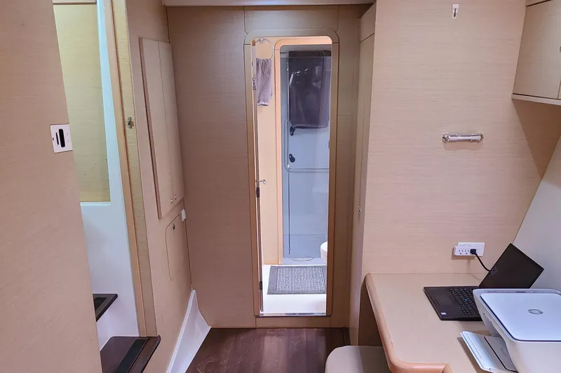 The Next Thing Yacht Photos Pics Interior of 2010 Lagoon 400 owner's version catamaran with modern furnishings and workspace.