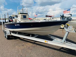 2014 Blazer Bay 2200 Professional boat on trailer, displayed outdoors.