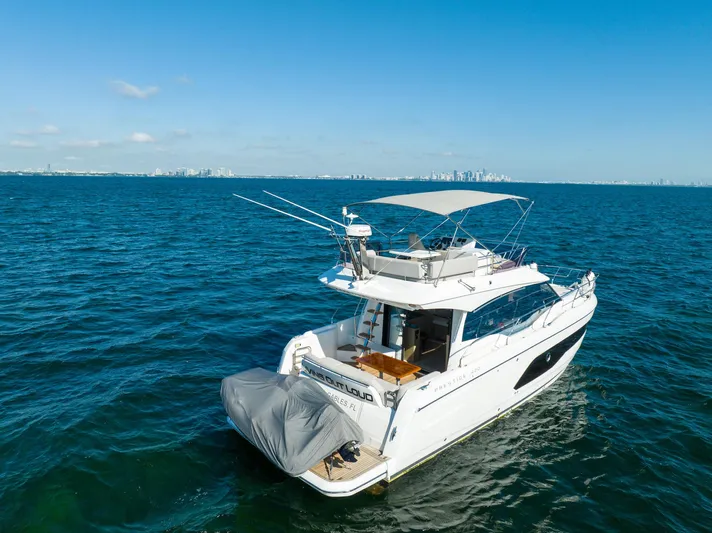 Living Out Loud Yacht Photos Pics Prestige 420 yacht cruising on open sea, 2020 model, clear blue sky.