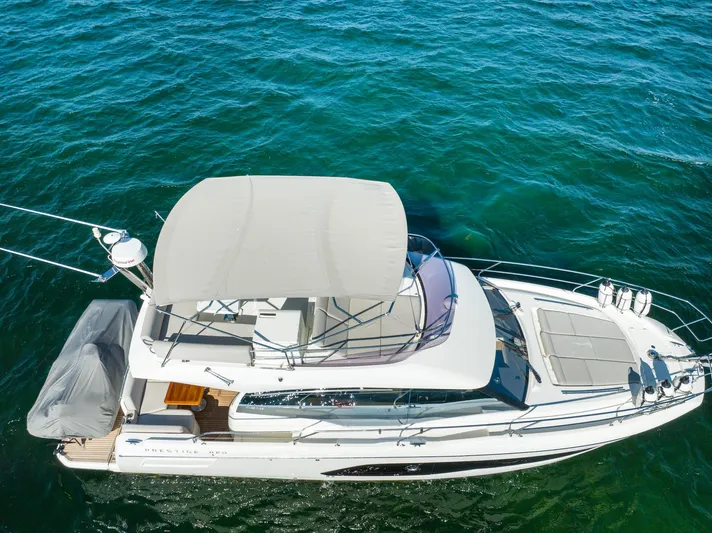 Living Out Loud Yacht Photos Pics Prestige 420 yacht, 2020 model, cruising on clear blue water.
