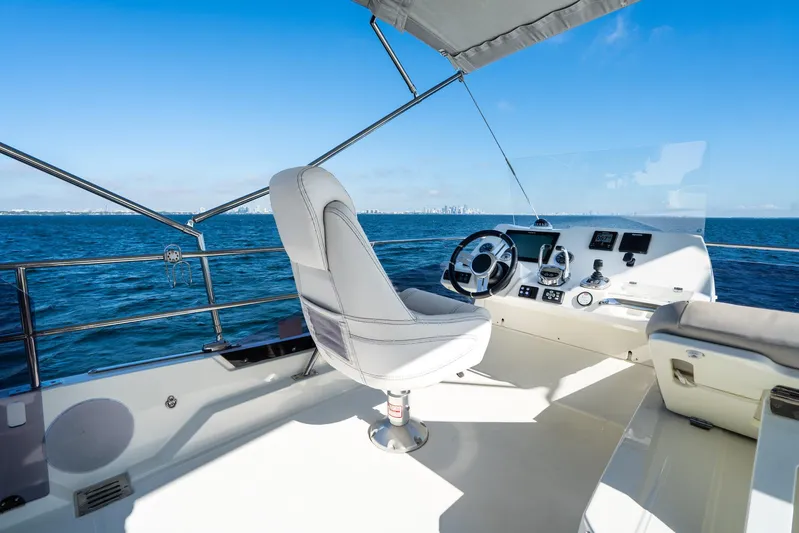 Living Out Loud Yacht Photos Pics Luxury yacht helm on a 2020 Prestige 420, overlooking the ocean.