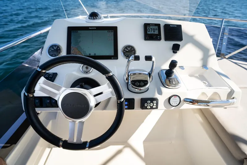 Living Out Loud Yacht Photos Pics Prestige 420 yacht helm, 2020 model, featuring advanced navigation controls and steering wheel.