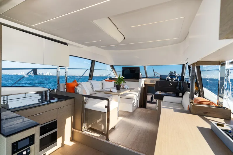Living Out Loud Yacht Photos Pics Luxurious interior of 2020 Prestige 420 yacht with modern furnishings and ocean view.