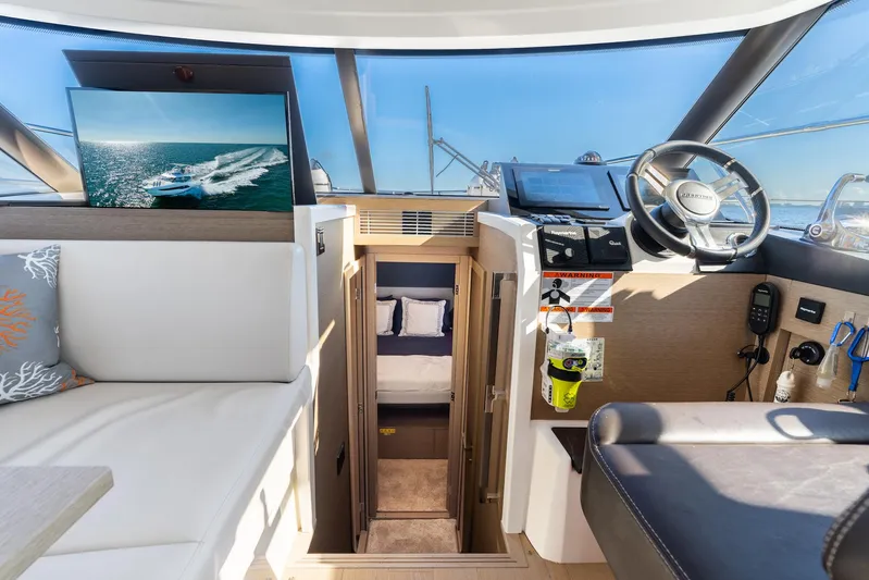 Living Out Loud Yacht Photos Pics Prestige 420 yacht interior, 2020 model, featuring helm and cabin entrance.