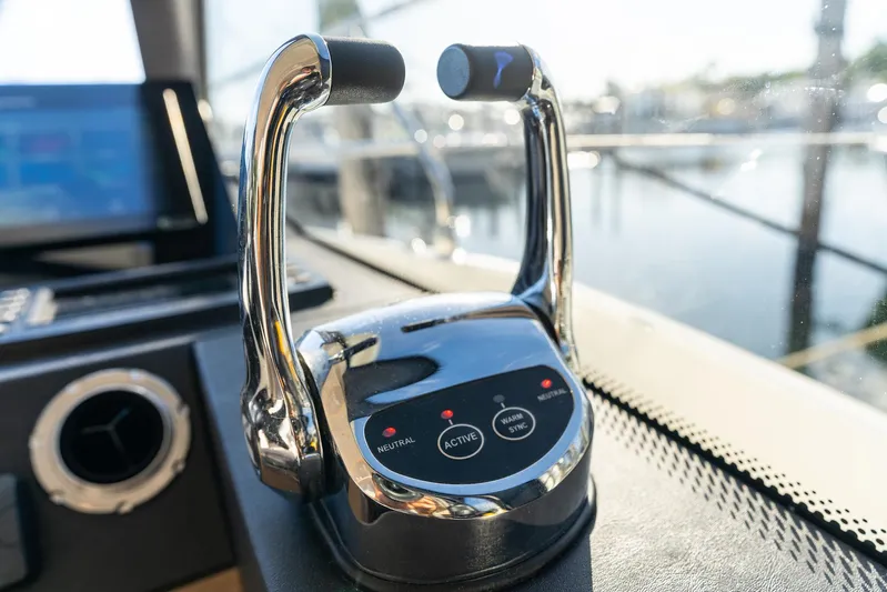 Living Out Loud Yacht Photos Pics Prestige 420 yacht throttle controls, 2020 model, with marina background.