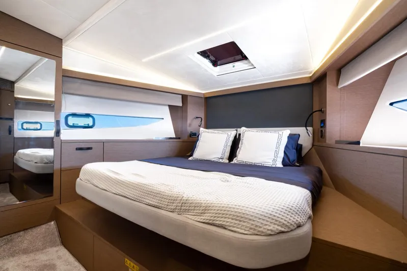 Living Out Loud Yacht Photos Pics Luxurious bedroom interior of 2020 Prestige 420 yacht with modern design and elegant lighting.