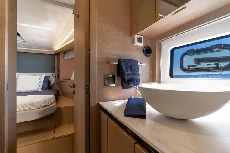 Living Out Loud Yacht Photos Pics Luxurious interior of 2020 Prestige 420 yacht with modern bedroom and bathroom.