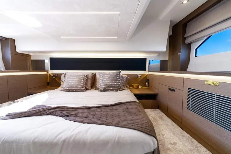 Living Out Loud Yacht Photos Pics Luxurious cabin interior of 2020 Prestige 420 yacht with modern design and cozy bedding.