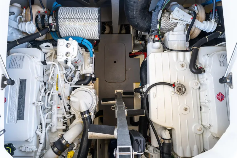 Living Out Loud Yacht Photos Pics Engine room of a 2020 Prestige 420 yacht, showcasing dual engines and components.