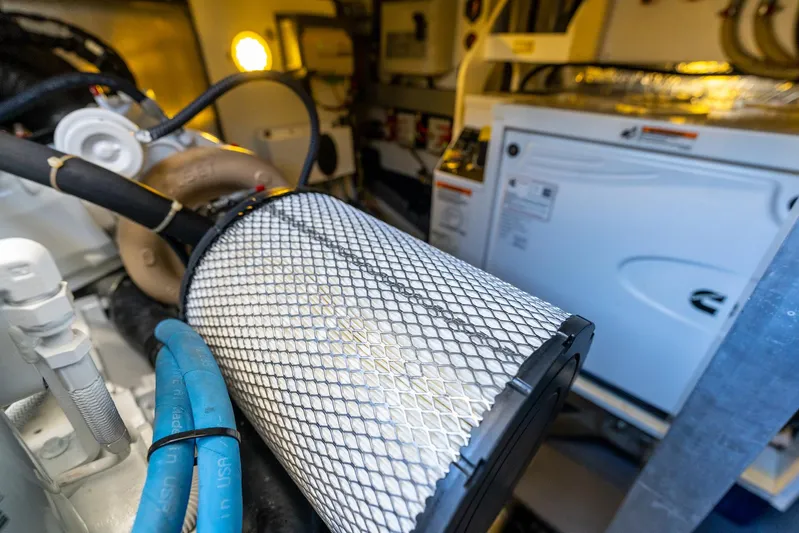 Living Out Loud Yacht Photos Pics Engine room of 2020 Prestige 420 yacht with visible machinery and components.