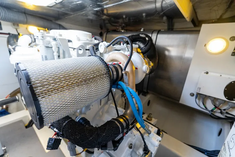 Living Out Loud Yacht Photos Pics Engine room of 2020 Prestige 420 yacht, showcasing mechanical components and wiring.